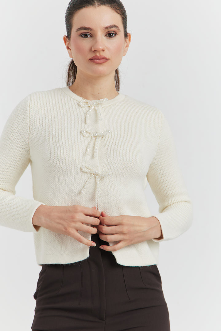 GILET BOUTONS PRESSIONS PERLES NYLERA ECRU